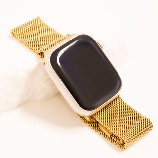 Smartwatch with a gold mesh band on a white background