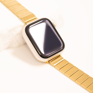 Smartwatch with a gold band on a white background