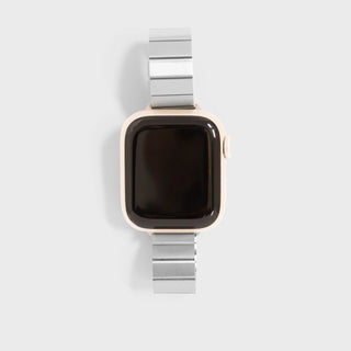 Smartwatch with a silver band on a light gray background