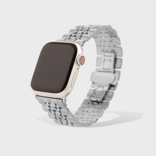 Smartwatch with a silver metal band on a light gray background