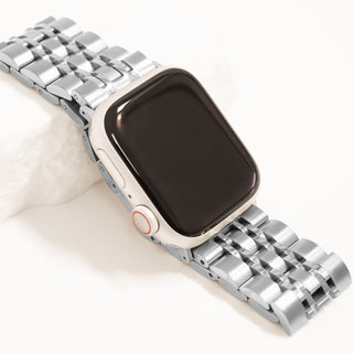 Smartwatch with a silver metal band on a white background