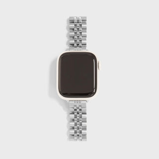 Smartwatch with a silver metal band on a light gray background