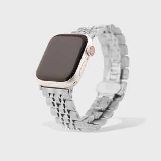 Smartwatch with a metallic band on a light gray background