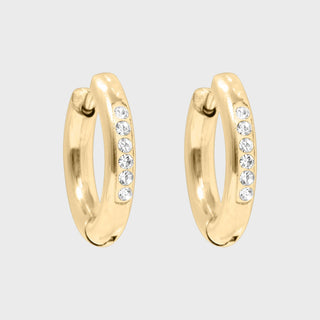 Gold hoop earrings with embedded crystals on a light gray background