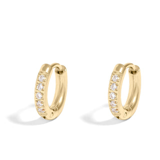 Gold hoop earrings with embedded stones on a white background