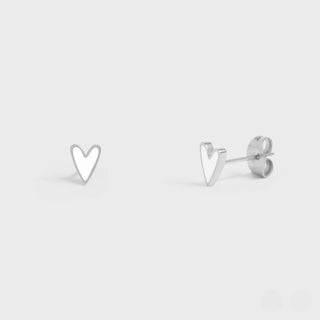Heart-shaped silver stud earrings on a light gray background