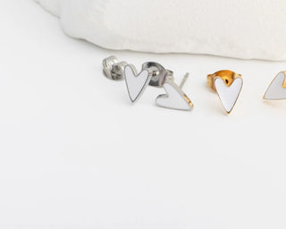 Heart-shaped earrings on a white background