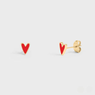 Gold Red heart-shaped earrings on a light gray background