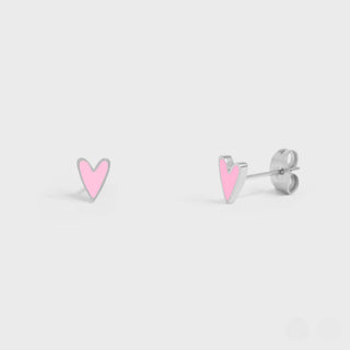 Pair of heart-shaped earrings with pink centers on a light gray background