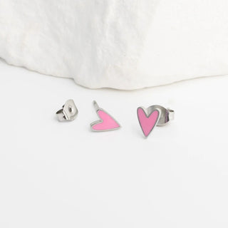 Heart-shaped earrings on a white background