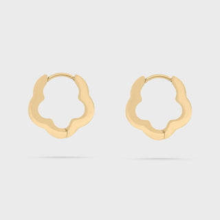 Gold floral hoop earrings on a light gray background