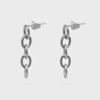 Silver chain link earrings on a light gray background