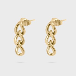 Gold chain-style earrings on a light gray background