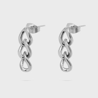 Pair of silver chain-style earrings on a light gray background