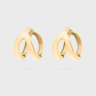 Gold hoop earrings on a light gray background
