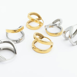 Set of gold and silver rings on a white background