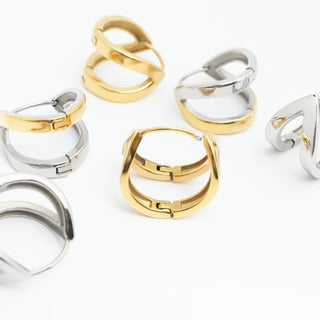 Set of gold and silver rings on a white background