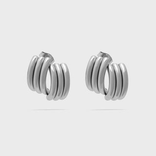Pair of silver hoop earrings on a white background