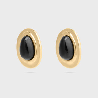 Pair of gold Black Enamel Stud Earrings with black stones on a light gray background