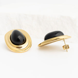 Gold Black Enamel Stud Earrings with black gemstone on a white background