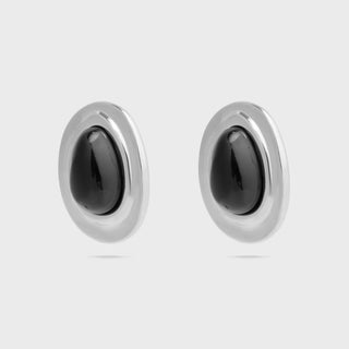 Pair of silver Black Enamel Stud Earrings with black stones on a light gray background