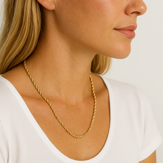 Gold rope chain necklace on woman's neck