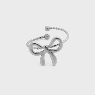 Silver bow-shaped bracelet on a light gray background