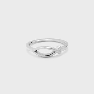 Silver ring with a modern design on a light gray background