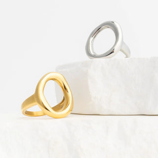 Gold and silver rings on a white surface