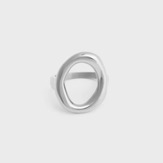 Silver ring on a light gray background