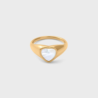 Gold ring with a heart-shaped MOP on a light gray background