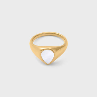 Gold ring with a MOP on a light gray background