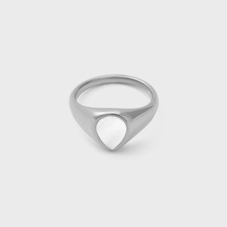 Silver ring with a unique design on a light gray background
