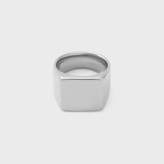 Silver square signet ring on a white background