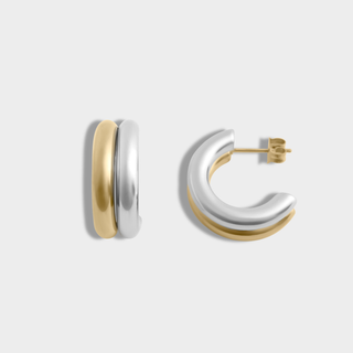Gold and silver hoop earrings on a light gray background