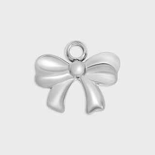 Silver bow-shaped pendant on a light gray background