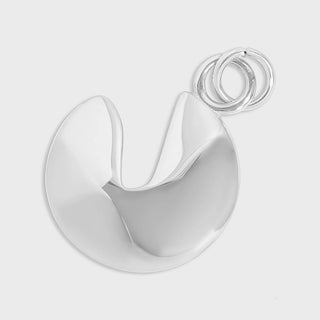 Silver fortune cookie charm on a light gray background