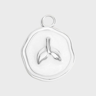 Silver pendant with a unique design on a light gray background