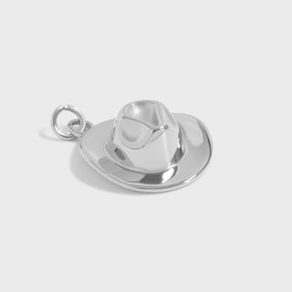 Silver cowboy hat charm on a white background