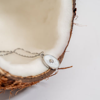 Necklace with a pendant on a half-coconut shell