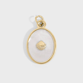 Gold pendant with a shell design on a white background