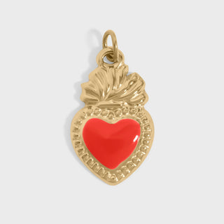 Gold pendant with a red heart on a light gray background