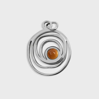 Silver pendant with a central amber stone on a light gray background