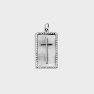 Silver cross pendant on a white background