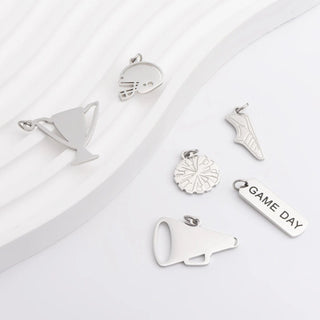 Collection of silver charms on a white background