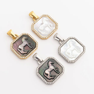 Four ornate pendants with intricate designs on a white background