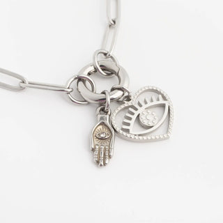 Silver bracelet with charms on a white background