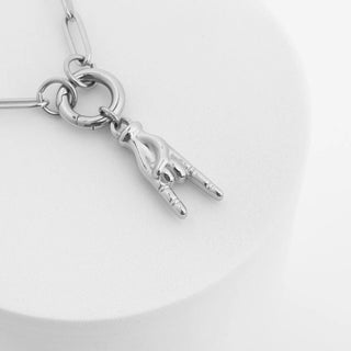Silver necklace with a unique pendant on a white background