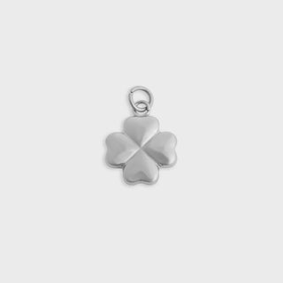 Silver four-leaf clover pendant on a light gray background