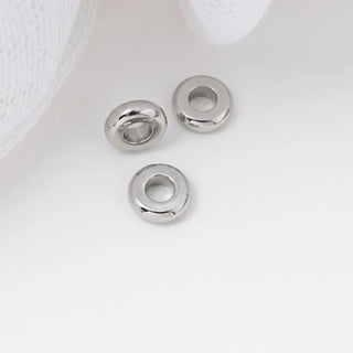 Three spacer beads on a white background